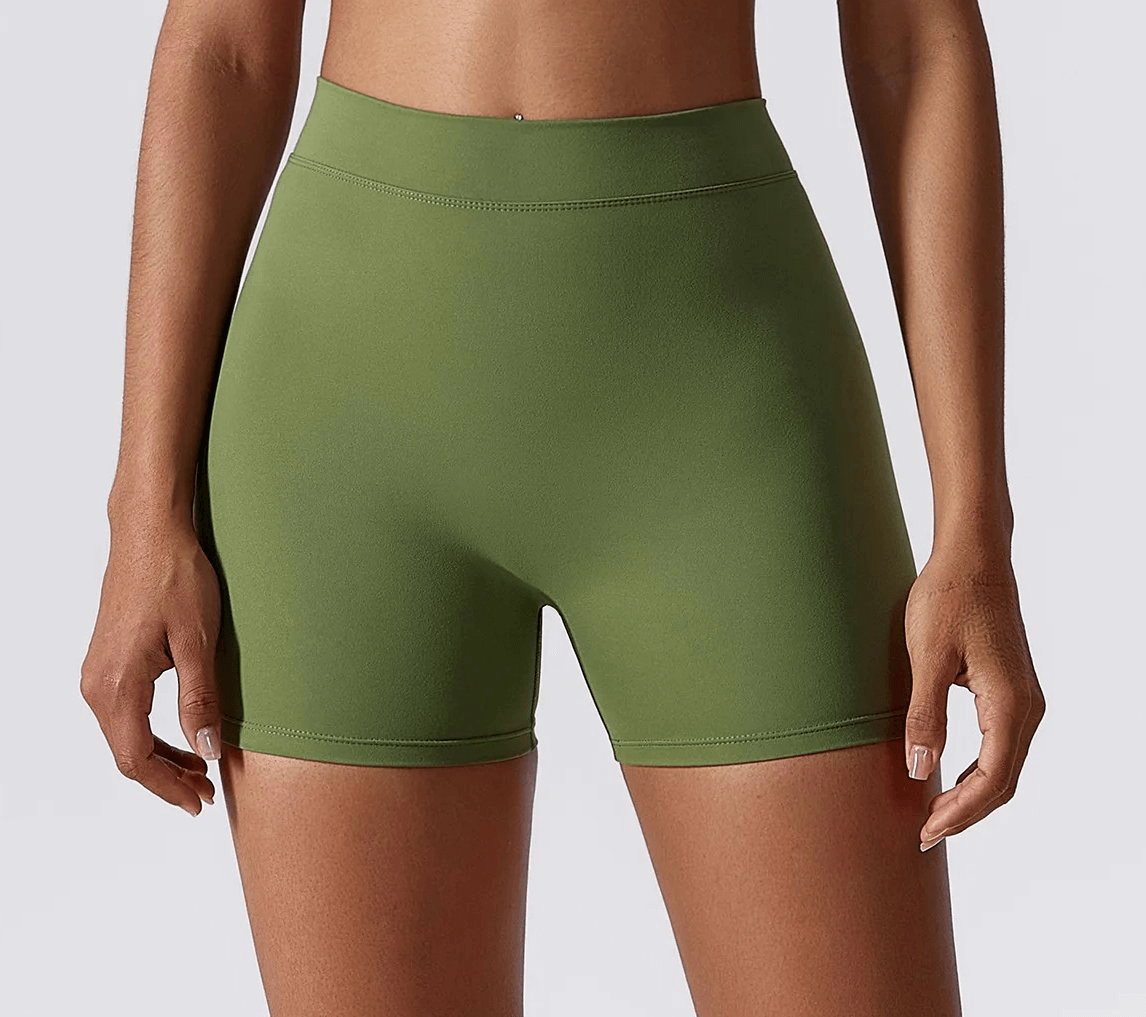 Women's elastic performance yoga shorts in olive green, ideal for active wear and sports. Nylon and spandex blend for flexibility.